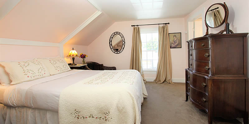 cambria bed and breakfast guest room with bed and dresser