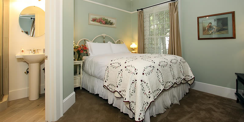 cambria bed and breakfast guest room with bed and chair